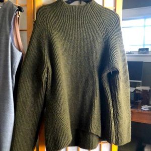 Green ribbed wool sweater